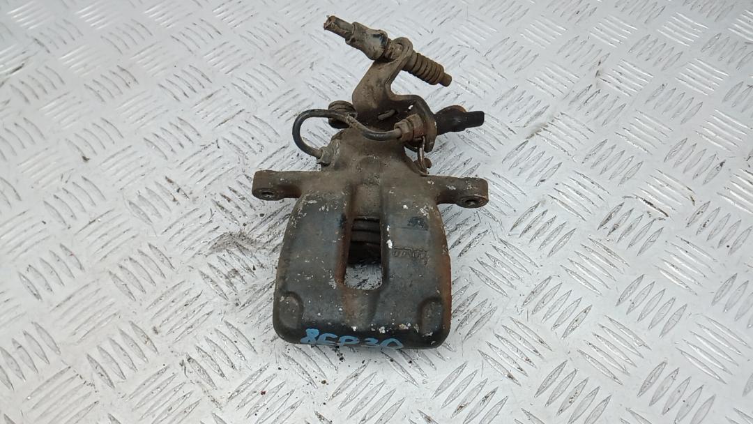 суппорт задний левый Volkswagen Jetta 5 поколение 2008, 1.9 л., дизель, МКПП, седан, 1K0615423M - фото №1