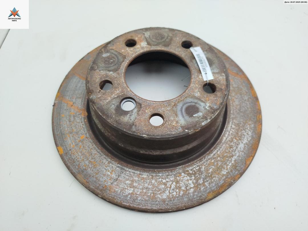 диск тормозной задний BMW 1 серия E81/E82/E87/E88 2005, 1.6 л., бензин, МКПП, чёрный, хетчбэк 5 дв. - фото №1