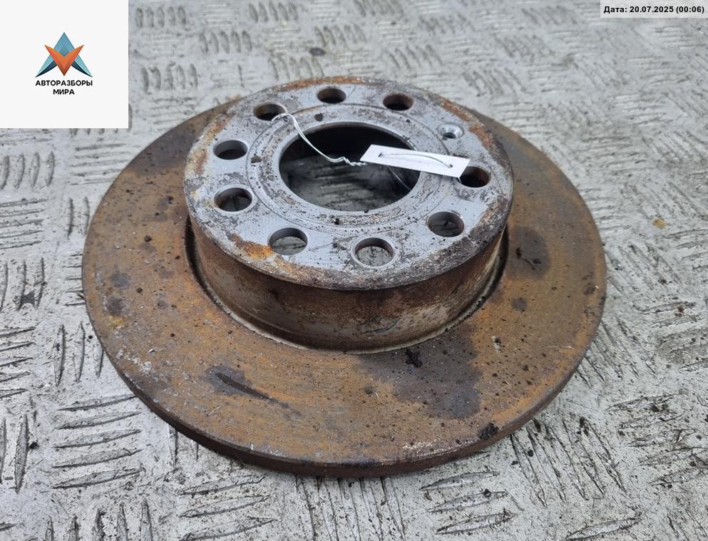 диск тормозной задний Volkswagen Caddy 3 поколение 2006, 1.9 л., дизель, МКПП, жёлтый, фургон - фото №1