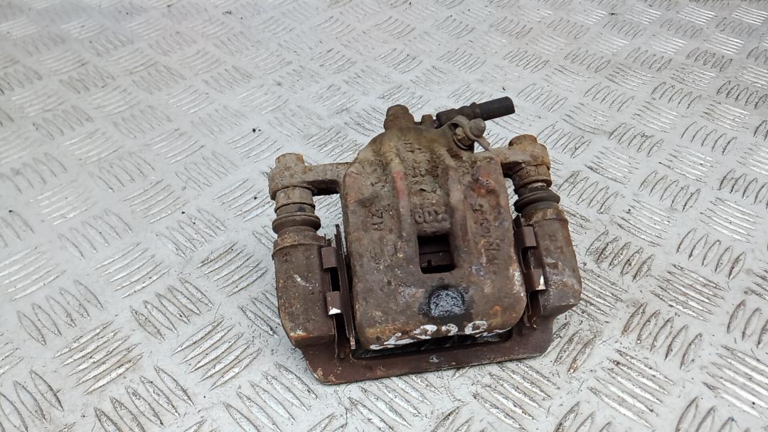 суппорт задний левый Hyundai Tucson 1 поколение 2006, 2.0 л., дизель, МКПП, внедорожник 5 дв. - фото №1