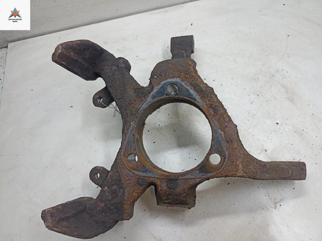 Кулак (корпус ступицы) передний левый Opel Astra G 1998, 1.2 л., бензин, МКПП, серый, хетчбэк 5 дв. - фото №1