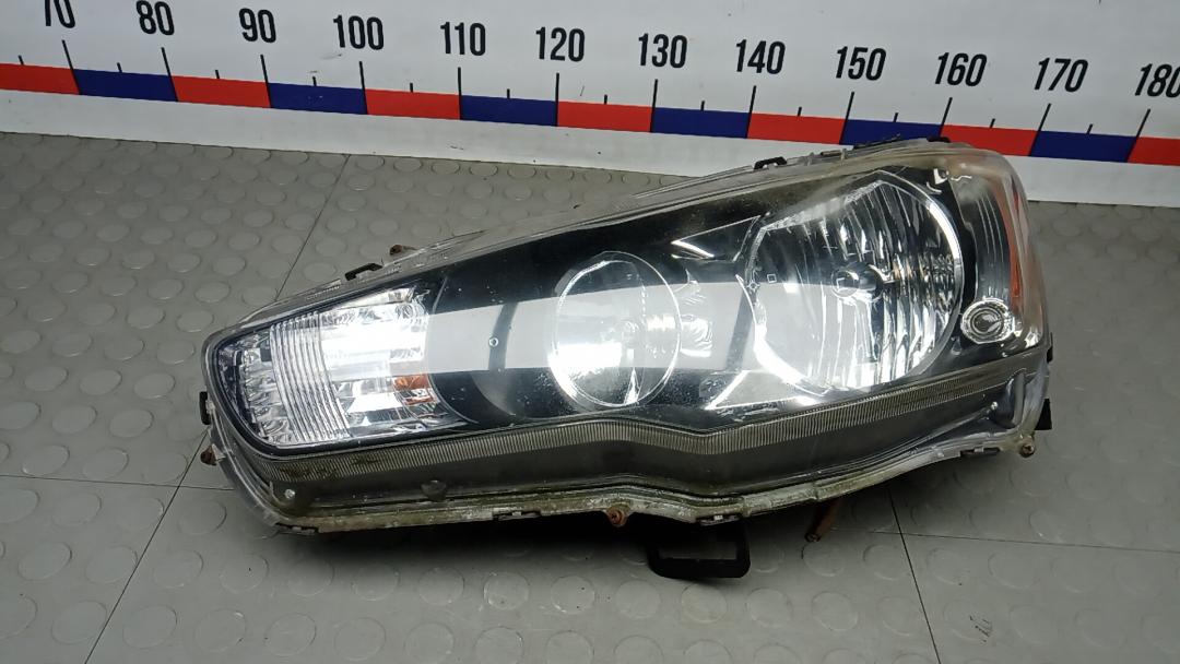 фара левая Mitsubishi Lancer 10 поколение 2010, 2.0 л., DiD, дизель, МКПП, хетчбэк 5 дв. - фото №1