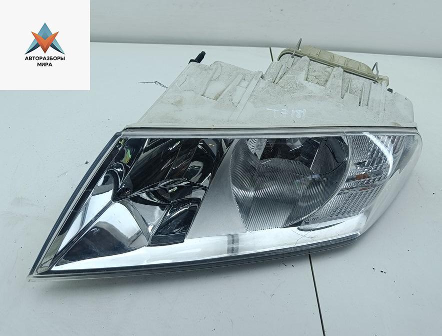 фара левая Skoda Octavia mk2 (A5 1Z) 2005, 1.6 л., бензин, МКПП, чёрный, универсал, 1EL354027 - фото №1