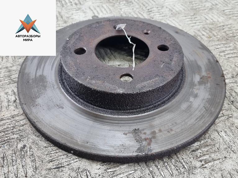 диск тормозной передний Volkswagen Passat B3 1991, 1.8 л., бензин, МКПП, зелёный, универсал - фото №1