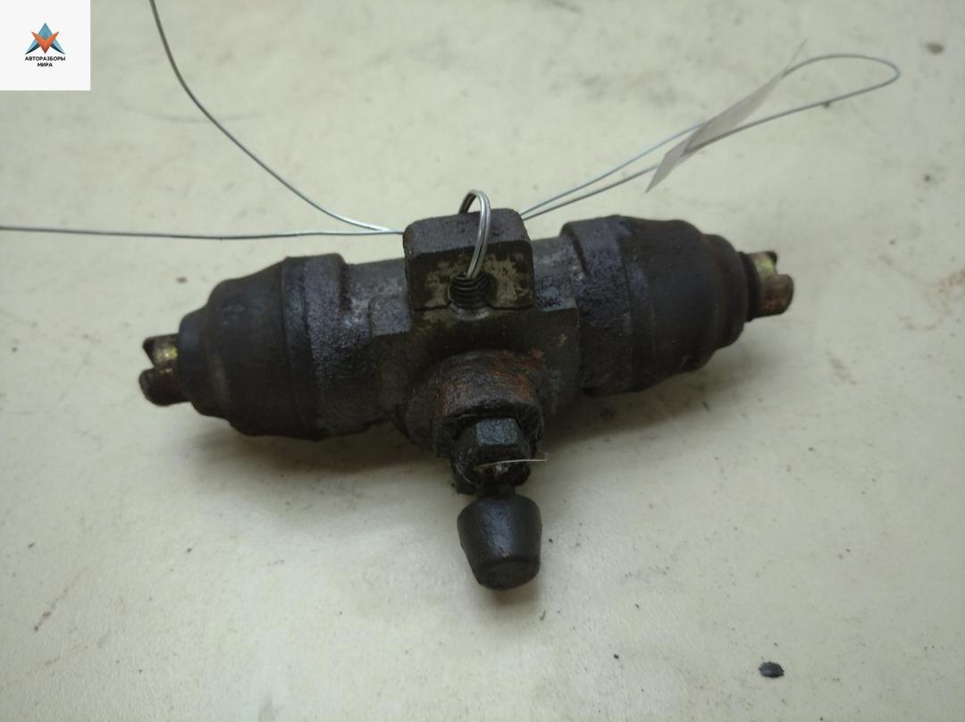 цилиндр тормозной рабочий Volkswagen Transporter T4 1992, 2.4 л., дизель, МКПП, красный, микроавтобус - фото №1