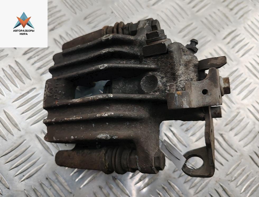 суппорт задний левый Volkswagen Golf 4 поколение 2001, 1.4 л., бензин, МКПП, серый, хетчбэк 5 дв. - фото №1