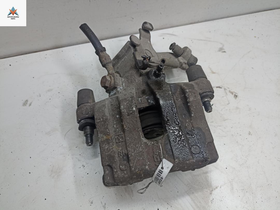 суппорт задний правый Opel Vectra C 2004, 2.2 л., бензин, АКПП, серый, хетчбэк 5 дв. - фото №1