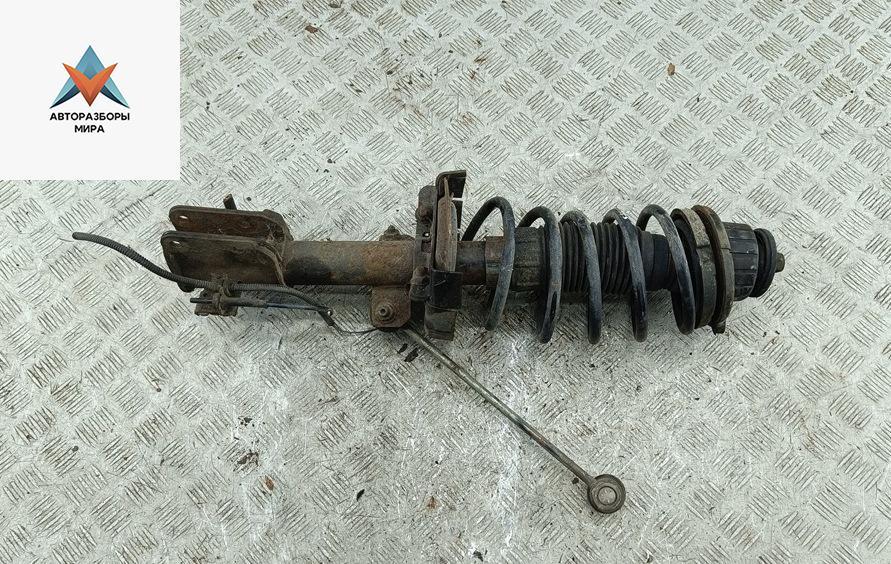 стойка передняя Fiat Stilo 1 поколение 2003, 1.6 л., бензин, МКПП, чёрный, хетчбэк 5 дв. - фото №1