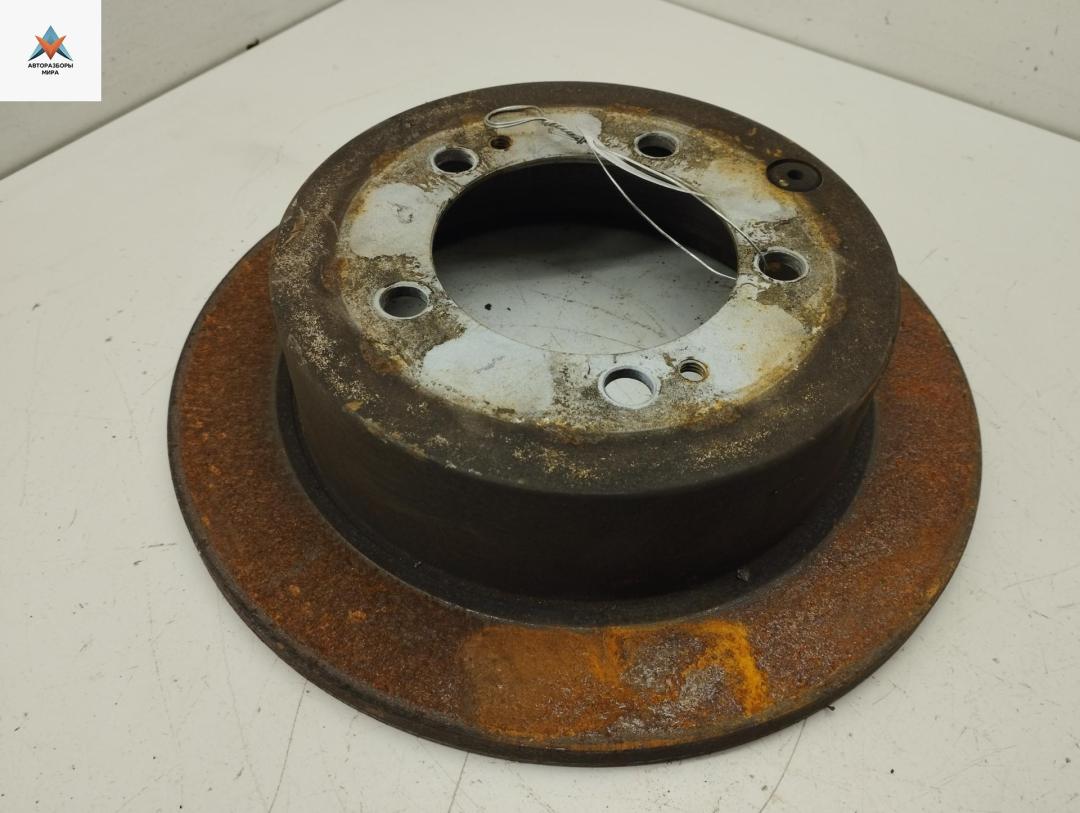 диск тормозной задний Mitsubishi Outlander 1 поколение 2006, 2.0 л., бензин, МКПП, чёрный, внедорожник 5 дв. - фото №1