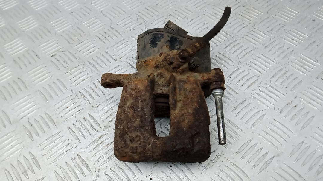 суппорт задний левый Volkswagen Tiguan 1 поколение 2010, 2.0 л., дизель, МКПП, внедорожник 5 дв. - фото №1