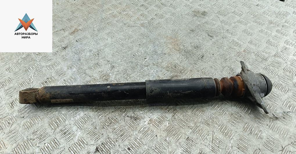 амортизатор задний левый Volkswagen Golf 6 поколение 2011, 1.6 л., дизель, МКПП, белый, хетчбэк 5 дв. - фото №1