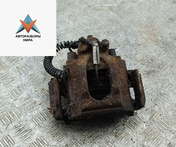 суппорт задний левый Volkswagen Touareg 1 поколение 2003, 2.5 л., дизель, АКПП, чёрный, внедорожник 5 дв. - фото №1