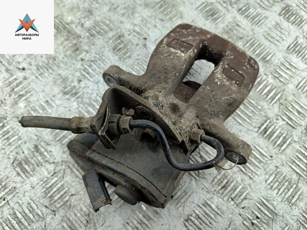 суппорт задний левый Volkswagen Passat B6 2008, 2.0 л., дизель, АКПП, чёрный, универсал - фото №1