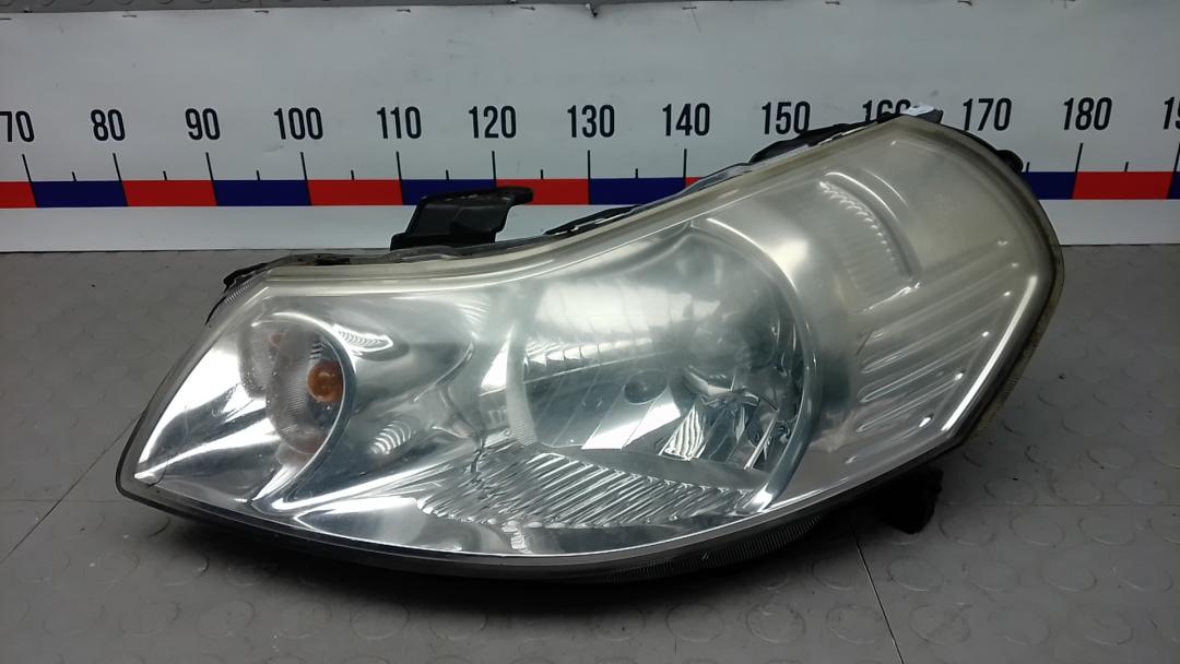 фара левая Suzuki SX4 1 поколение 2006, 1.6 л., бензин, МКПП, хетчбэк 5 дв. - фото №1