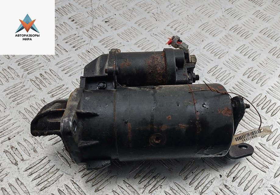 стартер Opel Vectra A 1991, 1.8 л., бензин, МКПП, красный, хетчбэк 5 дв. - фото №1