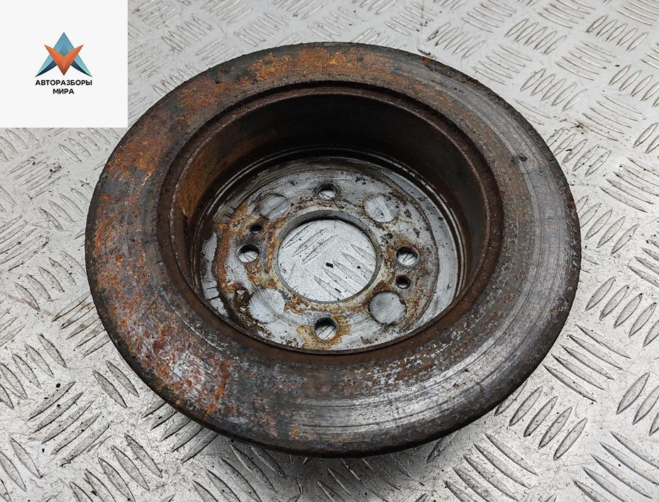 диск тормозной задний Kia Rio 2 поколение 2005, 1.6 л., бензин, МКПП, серый, хетчбэк 5 дв. - фото №1