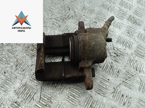 суппорт передний левый Dacia (Renault) Sandero I 2011, 1.5 л., дизель, МКПП, белый, хетчбэк 5 дв. - фото №1