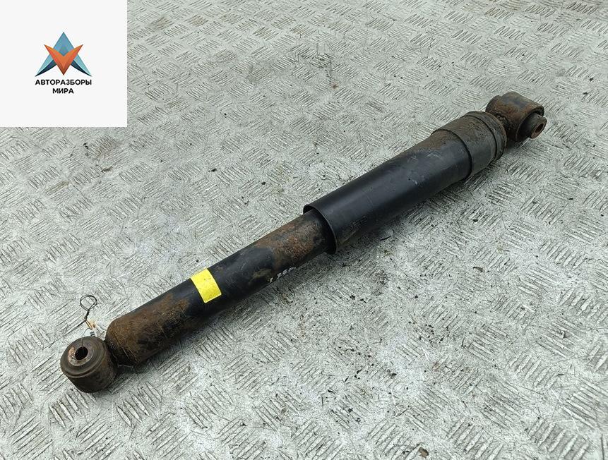 амортизатор задний левый Renault Laguna 3 поколение 2008, 2.0 л., бензин, МКПП, чёрный, универсал - фото №1