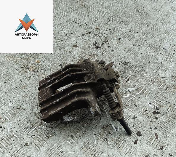 суппорт задний левый Volkswagen Golf 4 поколение 1999, 1.6 л., бензин, АКПП, серый, хетчбэк 5 дв. - фото №1