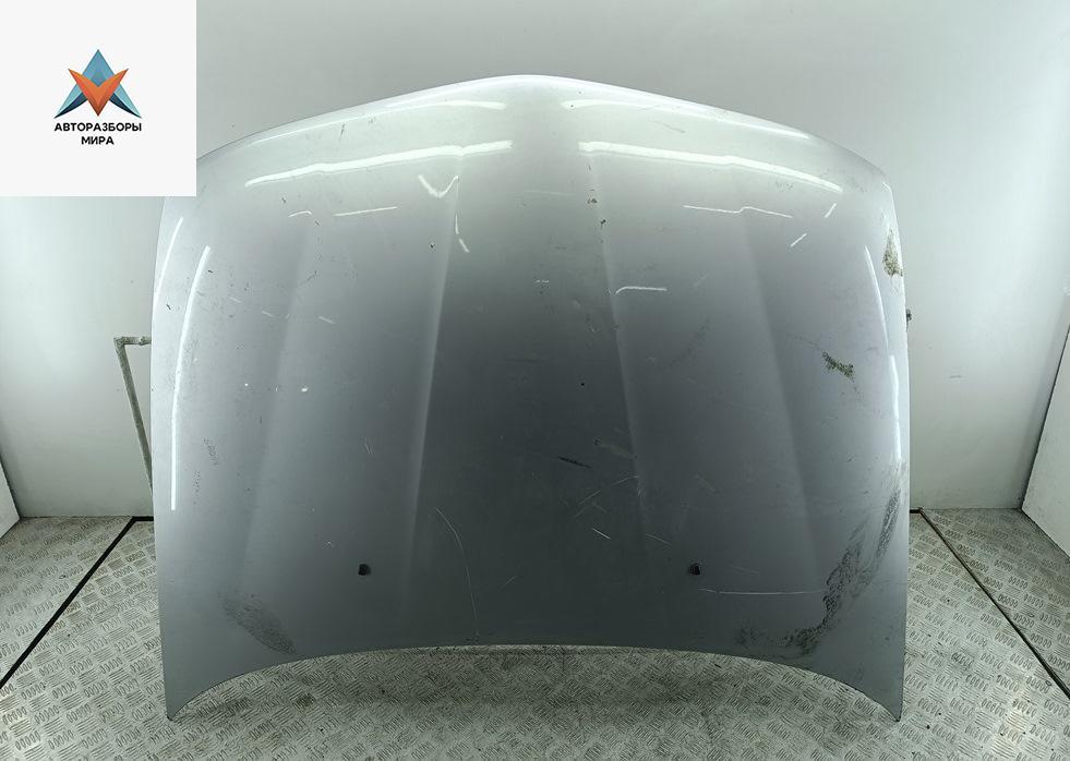 капот Mitsubishi Carisma 1 поколение 1998, 1.8 л., бензин, АКПП, серый, хетчбэк 5 дв. - фото №1