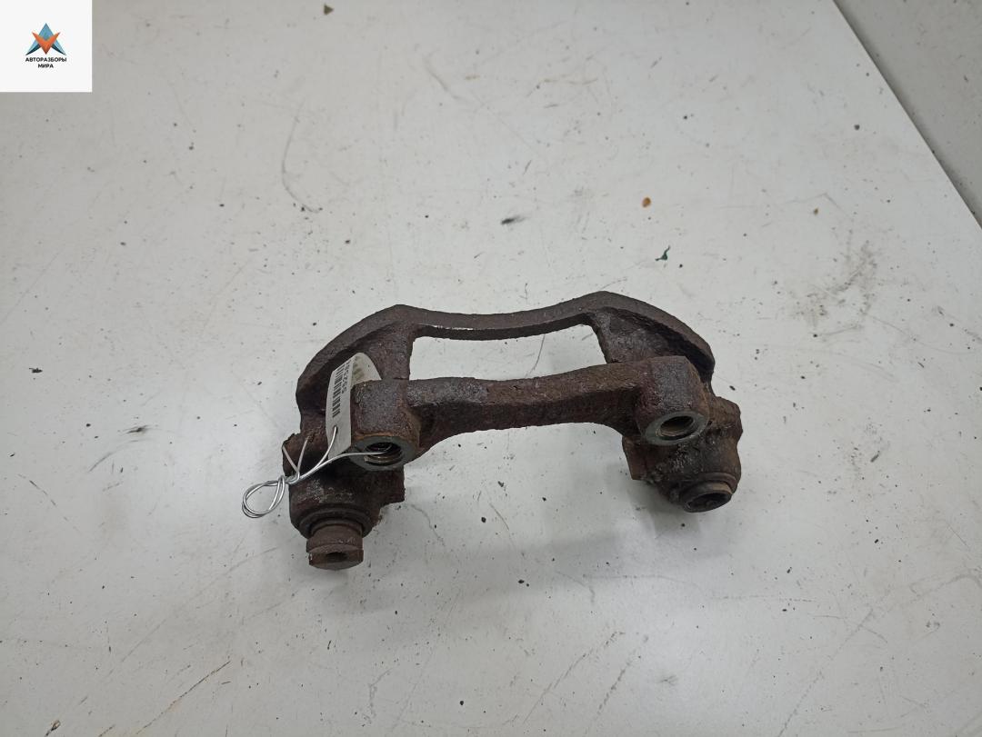 скоба суппорта Opel Astra G 1999, 2.0 л., дизель, МКПП, белый, универсал - фото №1