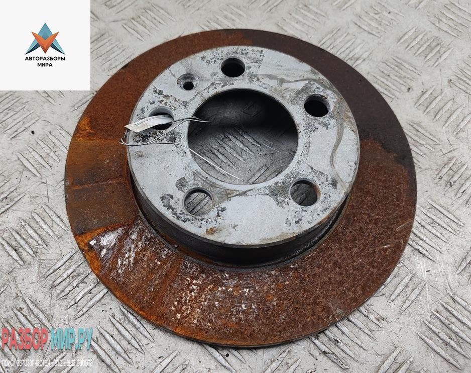 диск тормозной задний Volkswagen Golf 4 поколение 2002, 1.4 л., бензин, МКПП, чёрный, хетчбэк 5 дв. - фото №1