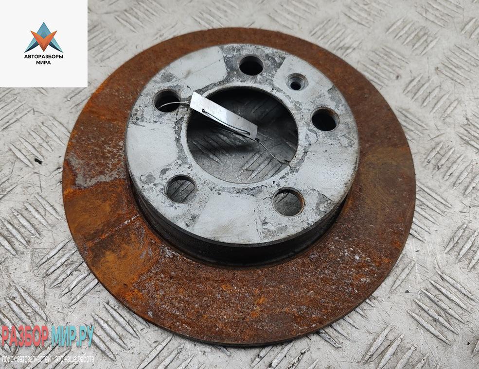 диск тормозной задний Volkswagen Golf 4 поколение 2002, 1.4 л., бензин, МКПП, чёрный, хетчбэк 5 дв. - фото №1