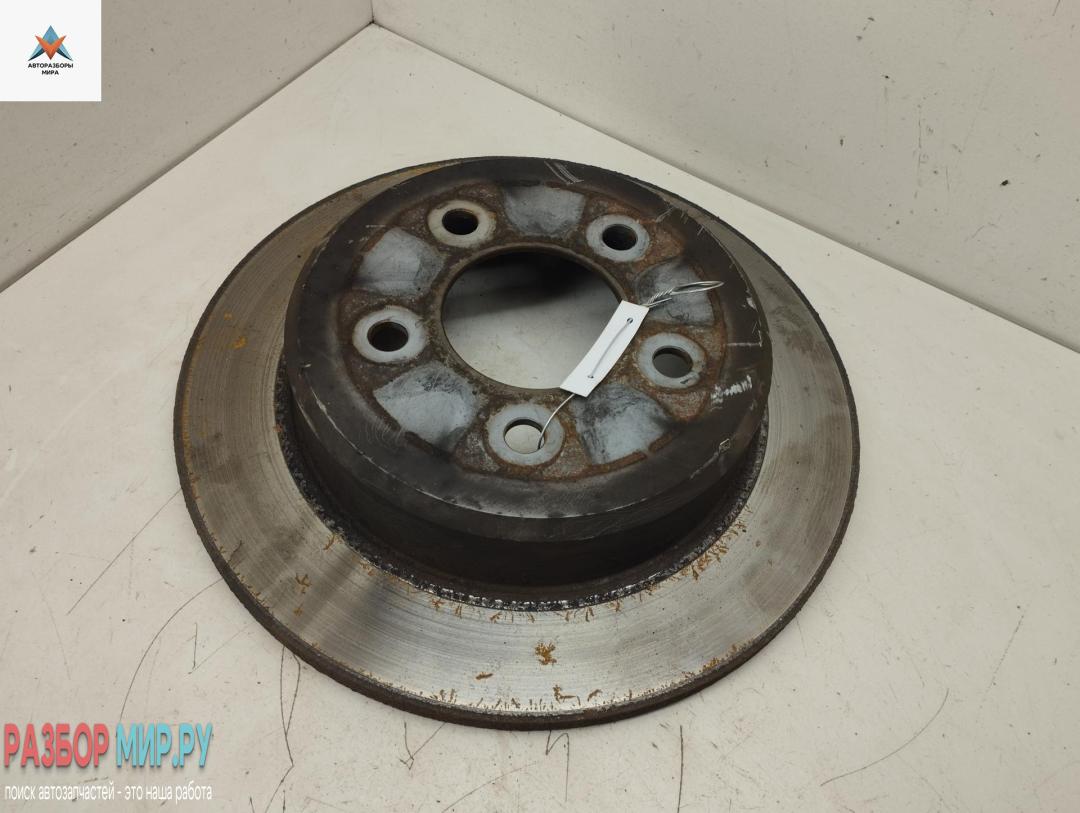 диск тормозной задний Chrysler Voyager 5 поколение 2007, 2.8 л., дизель, АКПП, серый, минивэн - фото №1