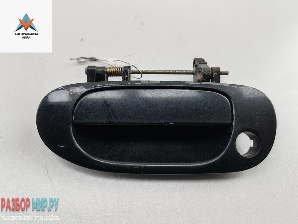 ручка наружная передняя левая Mitsubishi Carisma 1 поколение 1997, 1.8 л., бензин, МКПП, чёрный, хетчбэк 5 дв. - фото №1