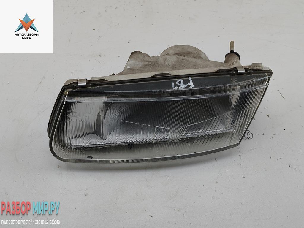 фара левая Mitsubishi Carisma 1 поколение 1997, 1.8 л., бензин, МКПП, чёрный, хетчбэк 5 дв., 14525900L - фото №1