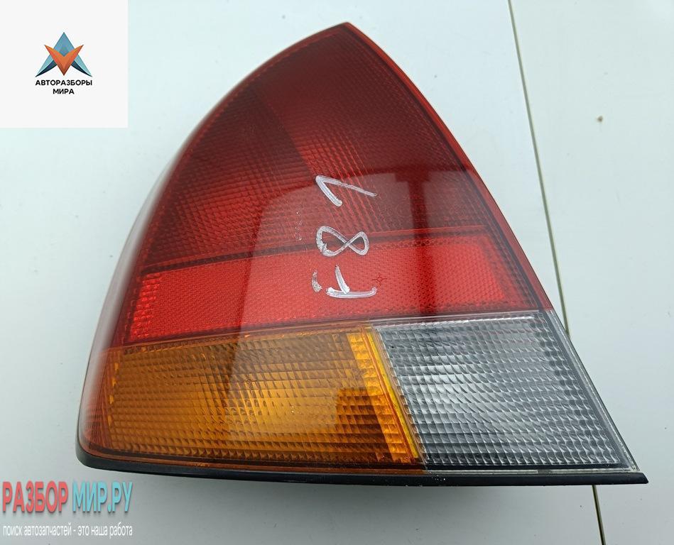 фонарь задний левый Mitsubishi Carisma 1 поколение 1997, 1.8 л., бензин, МКПП, чёрный, хетчбэк 5 дв., MB944543 - фото №1