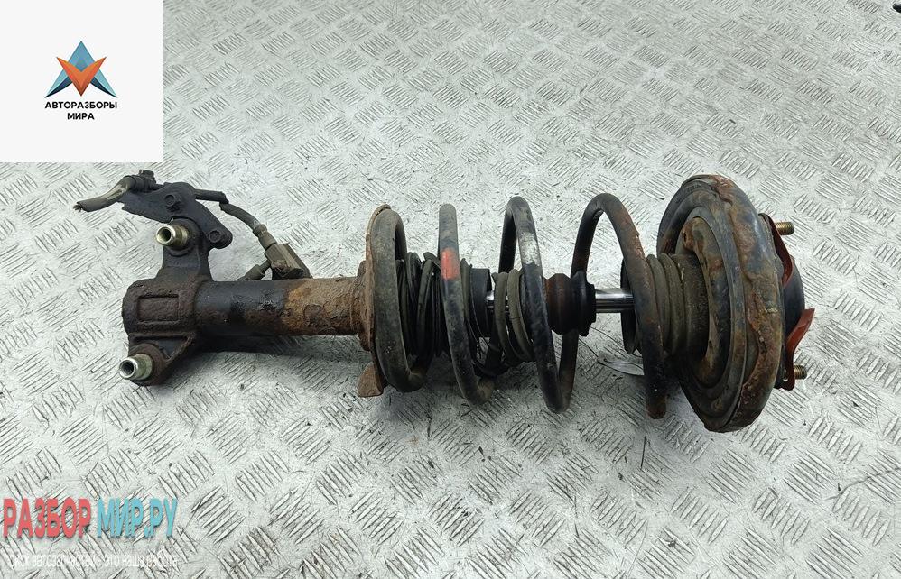 стойка передняя Nissan Primera P12 2002, 2.2 л., дизель, МКПП, серый, универсал - фото №1