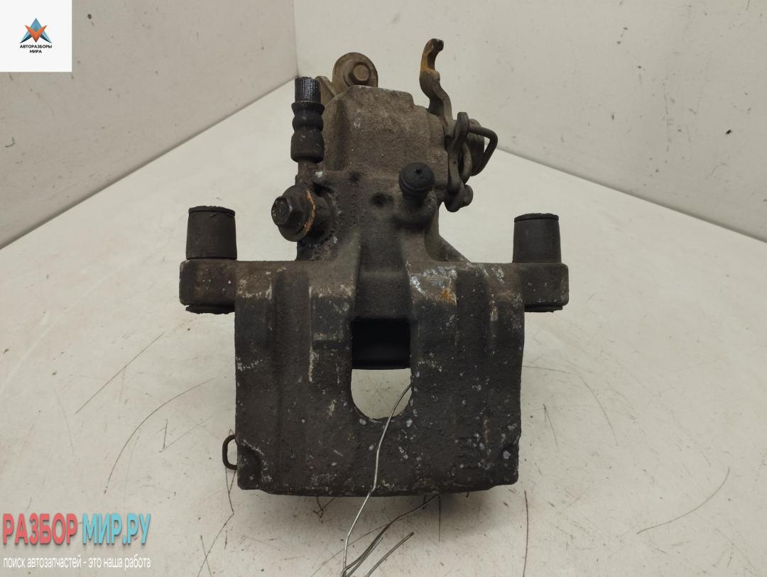 суппорт задний правый Nissan Primera P12 2002, 2.2 л., дизель, МКПП, серый, универсал - фото №1