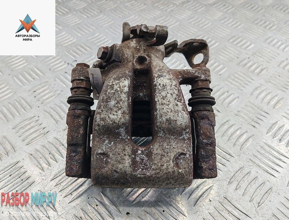 суппорт задний левый Opel Astra G 2004, 1.7 л., дизель, МКПП, белый, универсал - фото №1