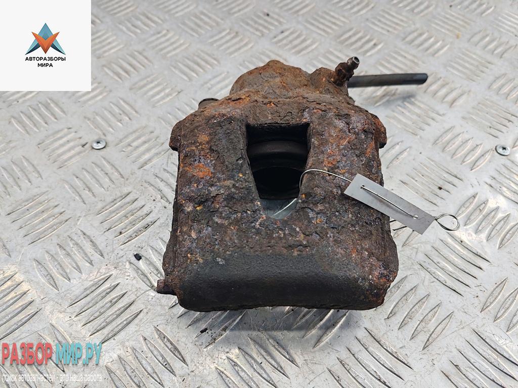 суппорт передний левый Volkswagen Bora 1 поколение 1999, 1.6 л., бензин, МКПП, чёрный, универсал - фото №1