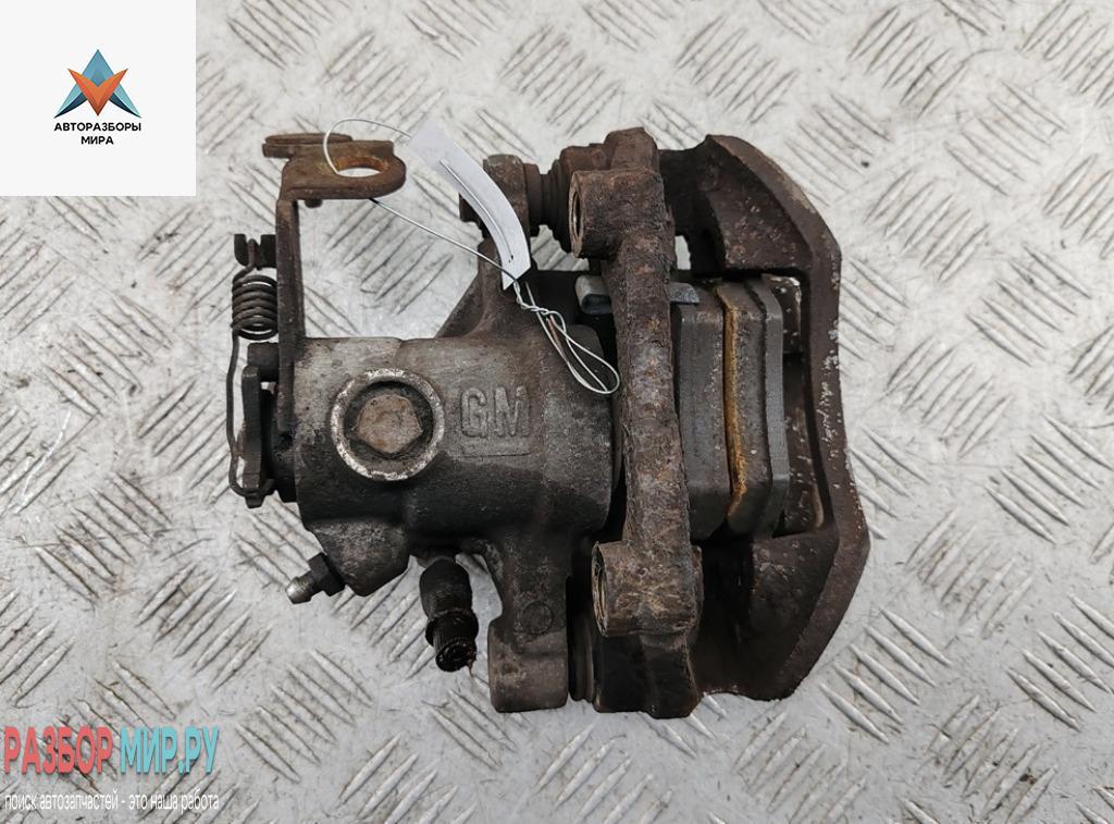 суппорт задний правый Opel Astra G 1998, 1.8 л., бензин, АКПП, серый, хетчбэк 5 дв. - фото №1