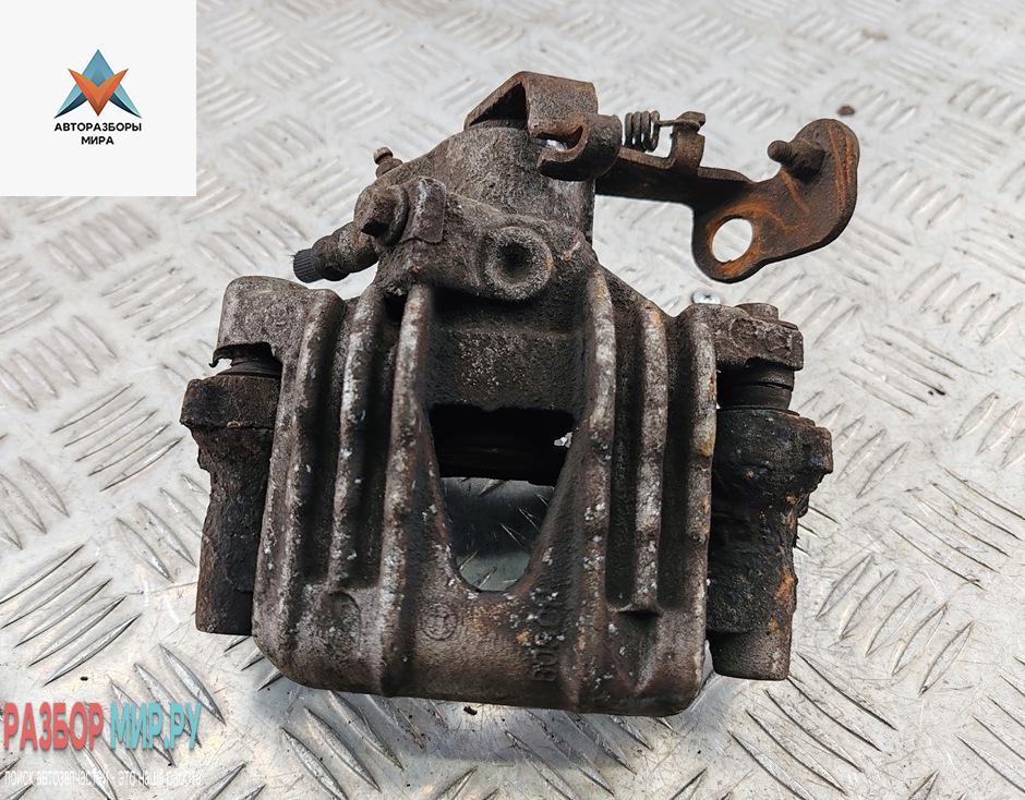 суппорт задний левый Opel Astra G 1998, 1.8 л., бензин, АКПП, серый, хетчбэк 5 дв. - фото №1