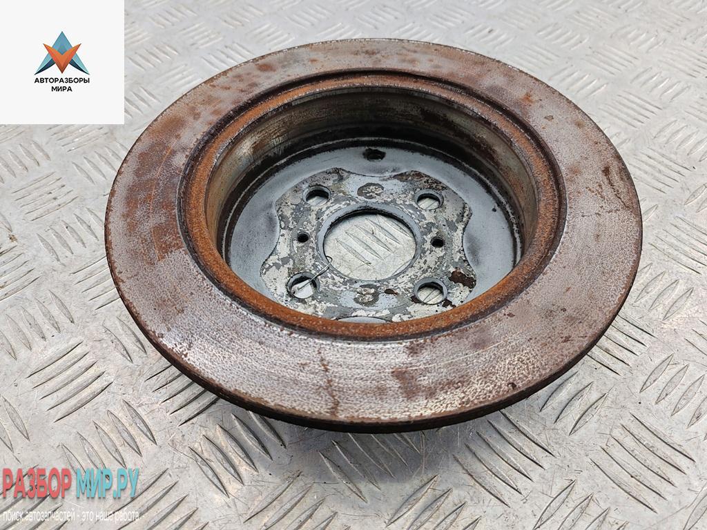 диск тормозной задний Toyota Yaris Verso 2001, 1.3 л., бензин, МКПП, серый, минивэн - фото №1