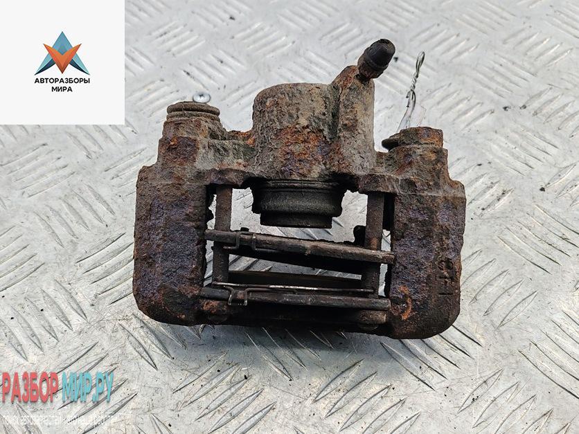 суппорт задний правый Toyota Yaris Verso 2001, 1.3 л., бензин, МКПП, серый, минивэн - фото №1