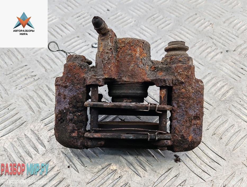 суппорт задний левый Toyota Yaris Verso 2001, 1.3 л., бензин, МКПП, серый, минивэн - фото №1