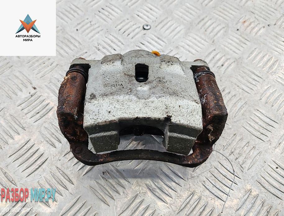 суппорт передний левый Toyota Yaris Verso 2001, 1.3 л., бензин, МКПП, серый, минивэн - фото №1