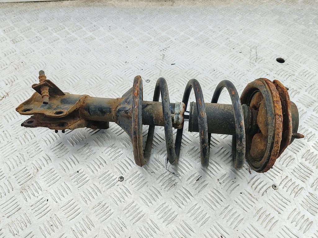 стойка передняя Mitsubishi Carisma 1 поколение 1998, 1.8 л., бензин, АКПП, зелёный, седан - фото №1