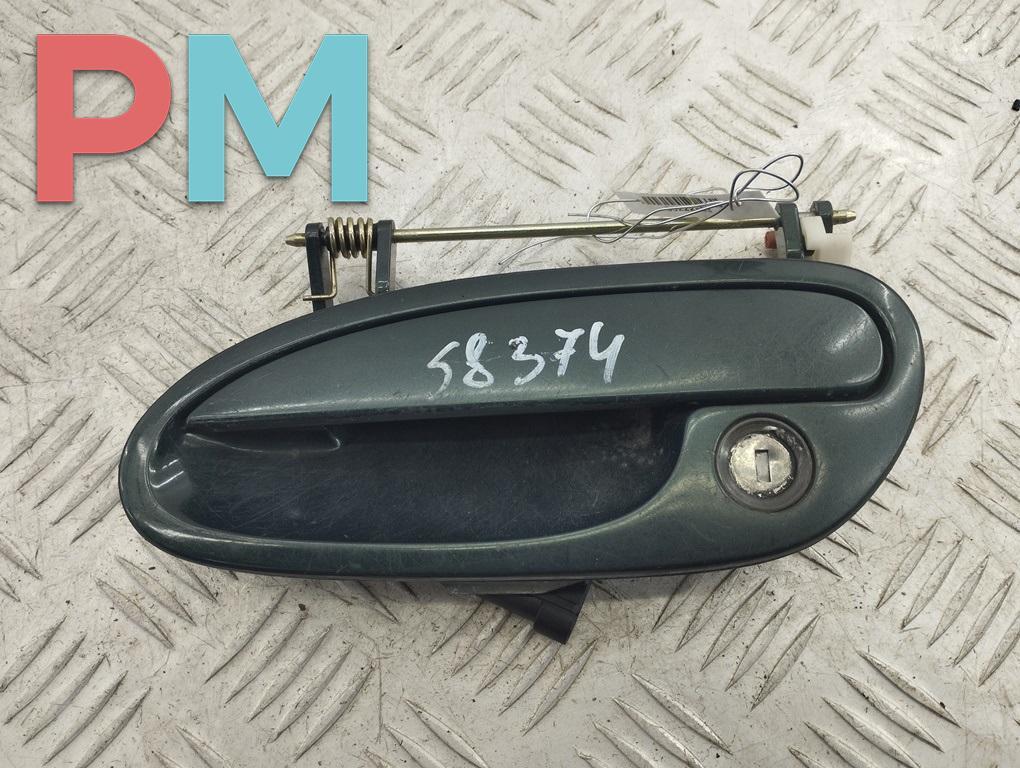ручка наружная передняя левая Opel Omega B 1997, 2.0 л., бензин, АКПП, зелёный, седан - фото №1