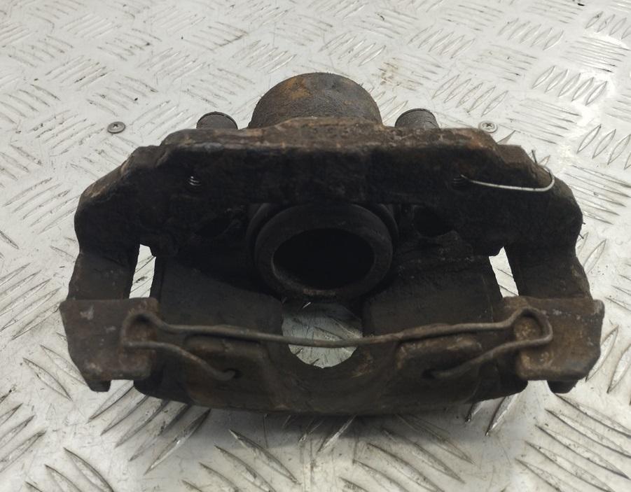 суппорт передний левый Ford Fiesta 5 поколение 2003, 1.6 л., i, бензин, МКПП, серый, хетчбэк 3 дв. - фото №1