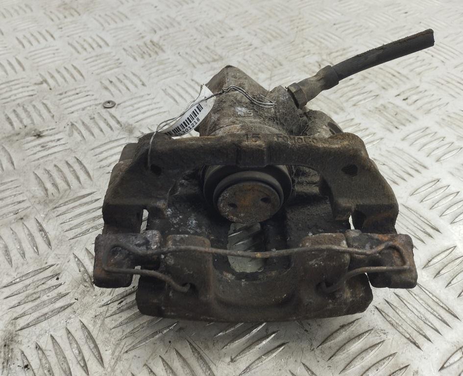 суппорт задний левый Ford Focus 2 поколение 2005, 1.6 л., i, бензин, МКПП, серый, хетчбэк 3 дв. - фото №1