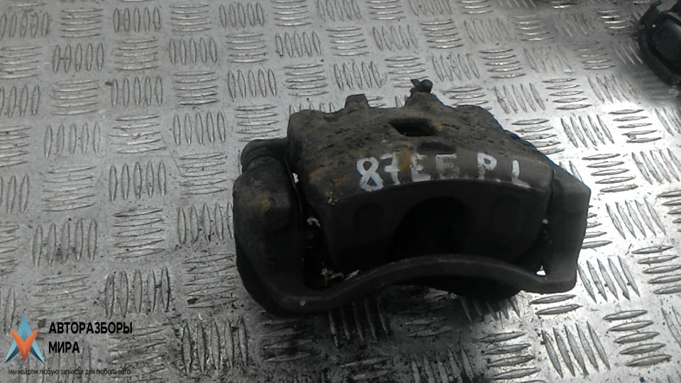 суппорт передний левый Hyundai Tucson 1 поколение 2006, 2.0 л., дизель, МКПП, внедорожник 5 дв., 581102E000, 581802EA00, 581802EA10, 581102E500, 581101F000 - фото №1