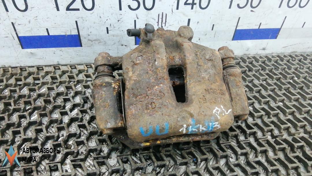 суппорт передний левый Kia Ceed 1 поколение 2007, 1.6 л., бензин, МКПП, хетчбэк 5 дв. - фото №1