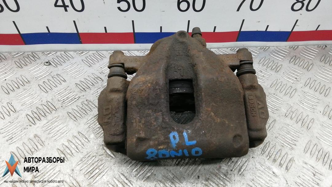 суппорт передний левый Toyota Auris 1 поколение 2007, 1.4 л., D-4D, дизель, МКПП, хетчбэк 5 дв. - фото №1