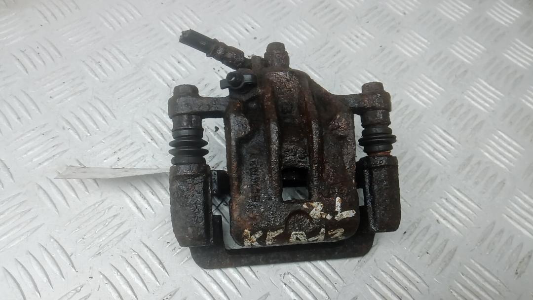 суппорт задний левый Kia Magentis 2 поколение 2007, 2.0 л., D CRDi, дизель, МКПП, седан, 582103K050 - фото №1